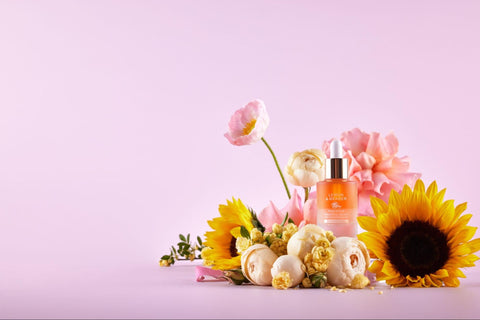 A bottle of niacinamide-containing serum set amongst flowers.